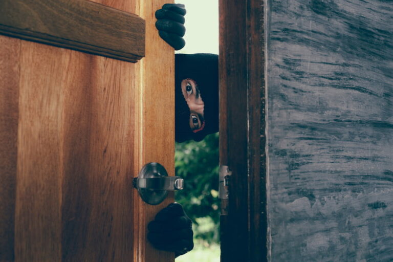 Best Ways to Secure Home from Intruders.The male thief appeared at the door of the house.